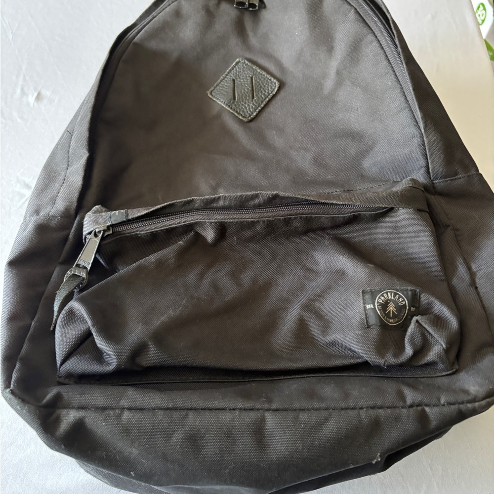Parkland Stylish Black Backpack with Front Zipper Pocket